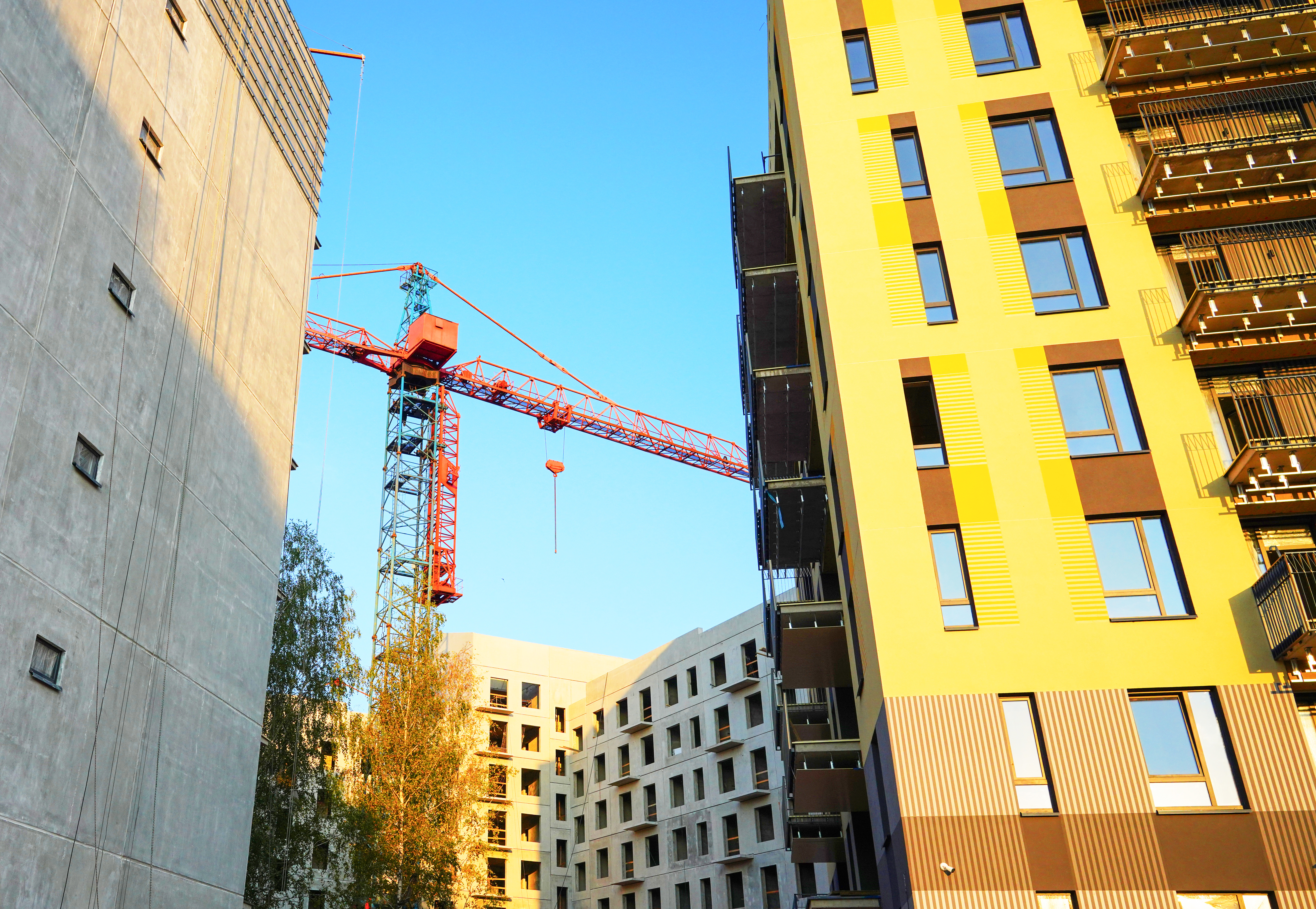 Construction crane against a clear sky — building a construction website that generates project leads